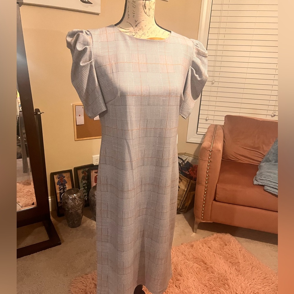 Nice dress for work or a business affair.